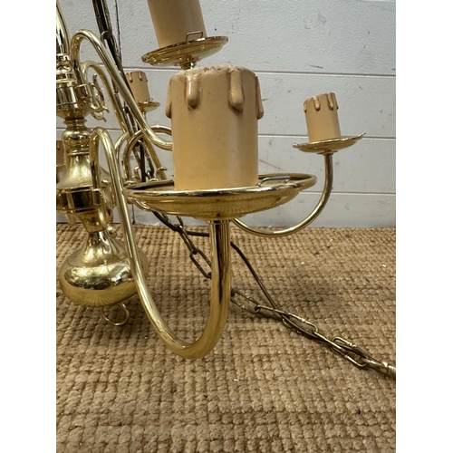 227 - A pair of brass nine arm chandelier ceiling lights