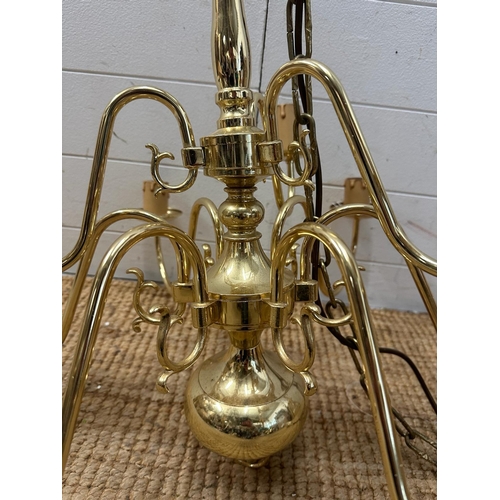 227 - A pair of brass nine arm chandelier ceiling lights