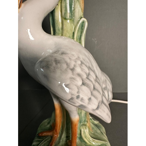 234 - An Art Nouveau style ceramic table lamp of a heron in the reeds (H42cm)