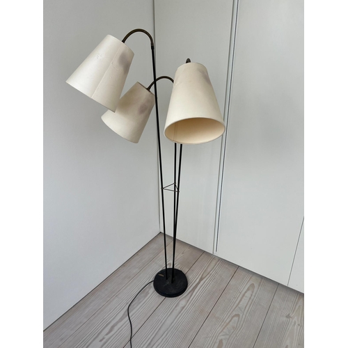 238 - A three arm floor lamp, brass and black enamelled stem with articulated three arm lamps possibly Dan... 