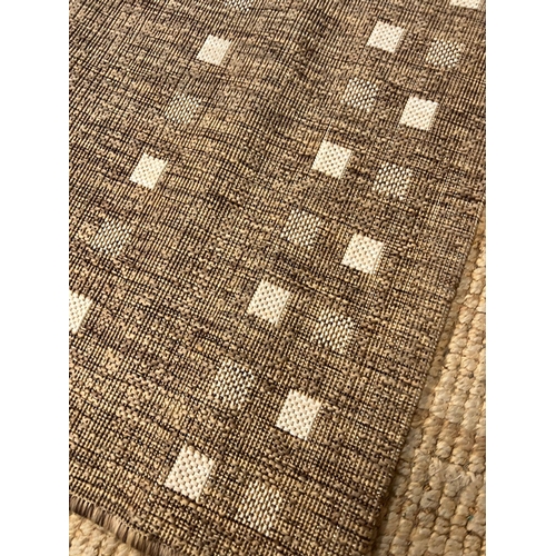 247 - A beige rug by Dunelm 80cm x 150cm