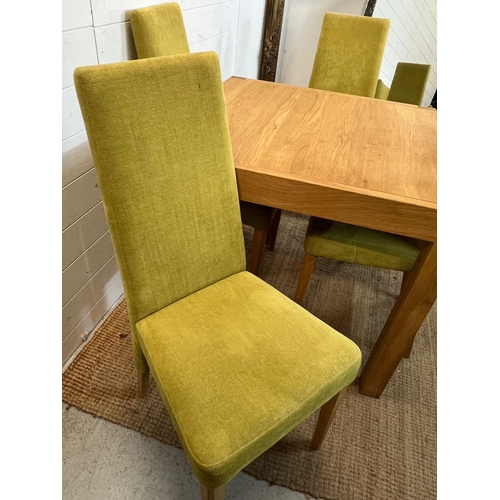 25 - A light oak dining table and four lime green chairs (H75cm Sq85cm)