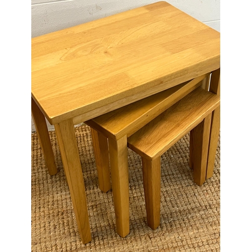 26 - A set of light oak nesting tables (H46cm W48cm D33cm)