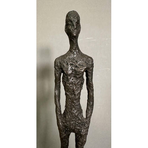 263 - A bronze sculpture of The Tall Man in a marble plinth and signed Giacometti to base