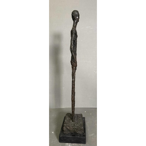 263 - A bronze sculpture of The Tall Man in a marble plinth and signed Giacometti to base