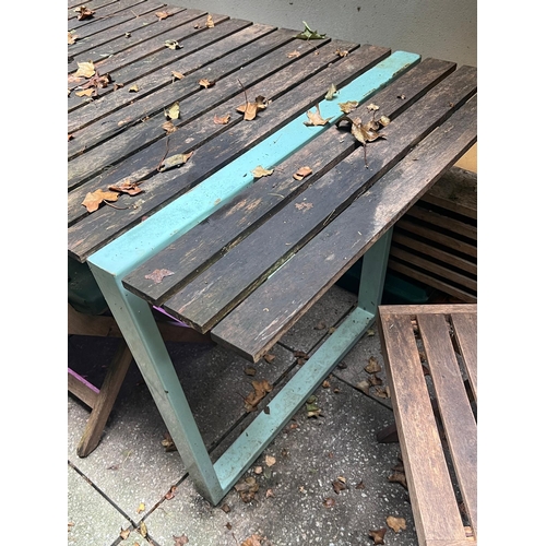 277 - A garden table with four slatted folding chairs, the table with slatted top and aqua metal frame (H7... 