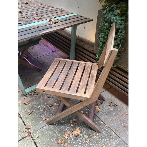 277 - A garden table with four slatted folding chairs, the table with slatted top and aqua metal frame (H7... 