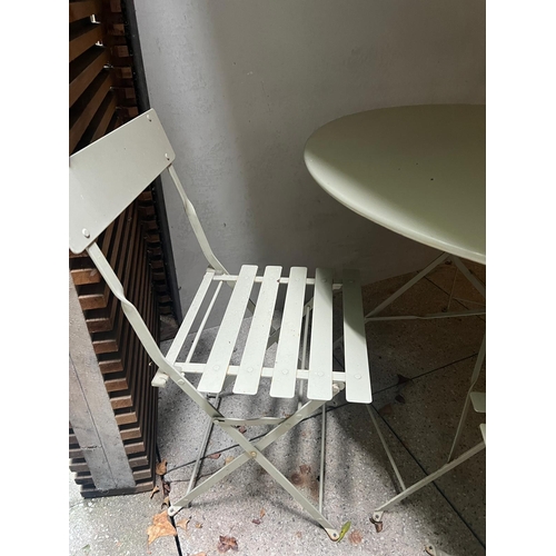 278 - A metal bistro set comprising of a table and four folding chairs (H74cm Dia97cm)