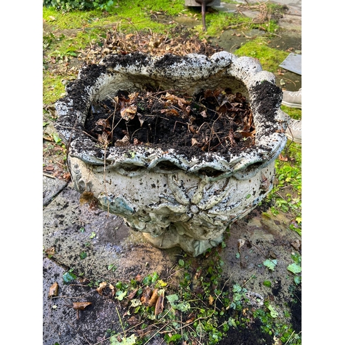 289 - A glazed ceramic planter with platted design around the top and natural scene including a clock in a... 