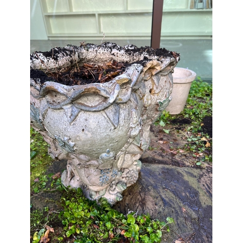 289 - A glazed ceramic planter with platted design around the top and natural scene including a clock in a... 