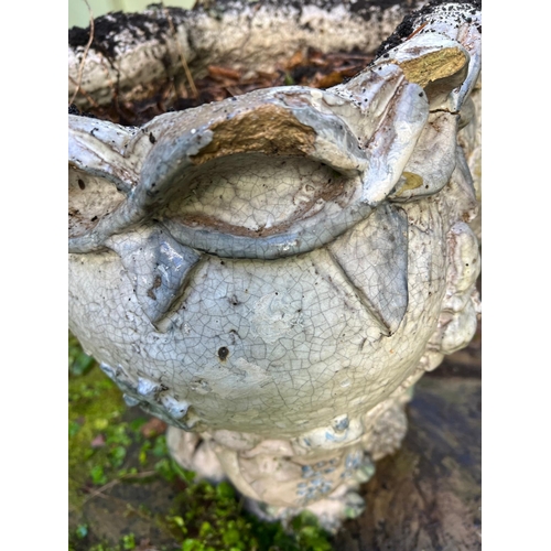 289 - A glazed ceramic planter with platted design around the top and natural scene including a clock in a... 