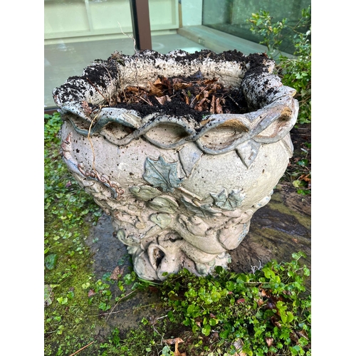 289 - A glazed ceramic planter with platted design around the top and natural scene including a clock in a... 