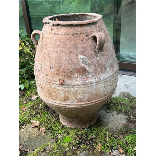 296 - A large olive pitcher terracotta urn with three handles (H83cm Dia39cm)