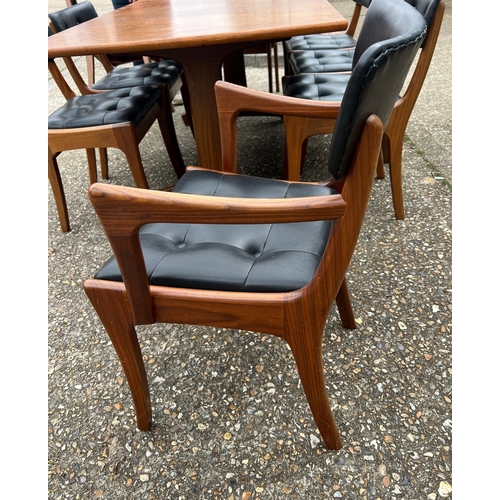 3 - An extending teak dining table by Vanson along with the Vanson for Heals eight chairs whit black pos... 