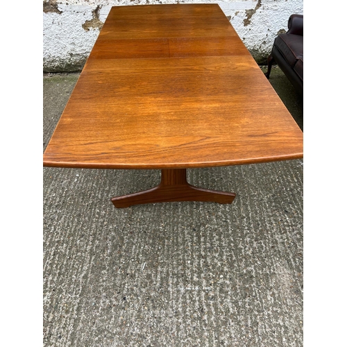 3 - An extending teak dining table by Vanson along with the Vanson for Heals eight chairs whit black pos... 