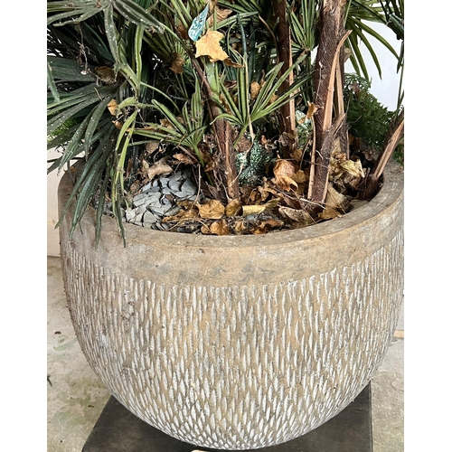 304 - An artificial palm and ivy plants in a ribbed pot (H50cm Dia58cm)