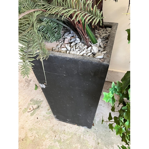 309 - A pair of Slate style pots with artificial flowers