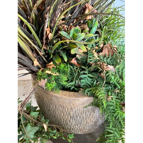 318 - A large round ribbed planter with artificial perennial plants (H46cm)