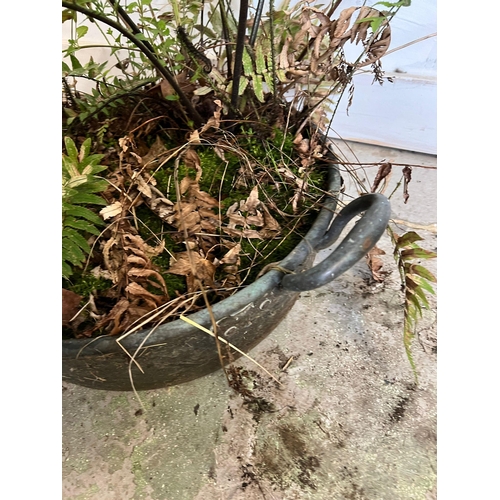 320 - A weathered copper pan used as a planter (H20cm W60cm)