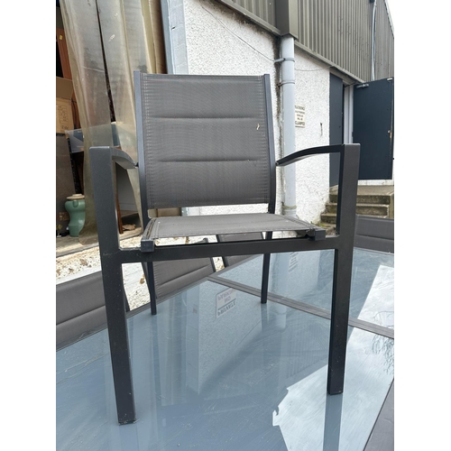 355 - A contemporary grey metal garden table with two piece glass top and eight garden chairs by Alice’s G... 