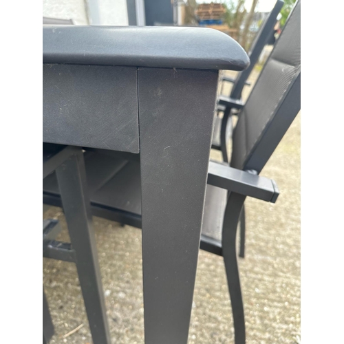 355 - A contemporary grey metal garden table with two piece glass top and eight garden chairs by Alice’s G... 