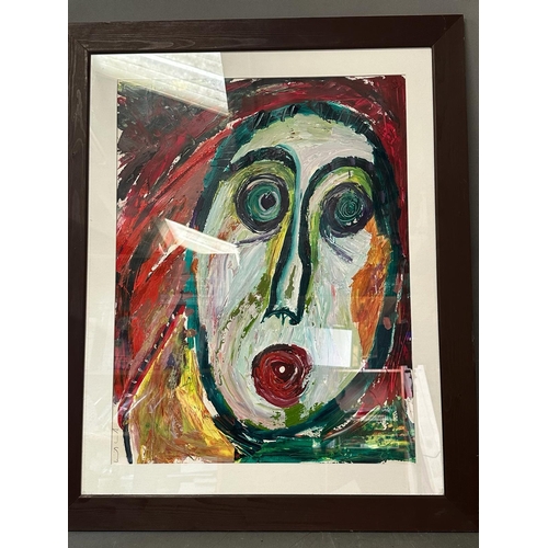 360 - An abstract oil on paper of a haunted man in reds and greens signed lower left 68cm x 84cm