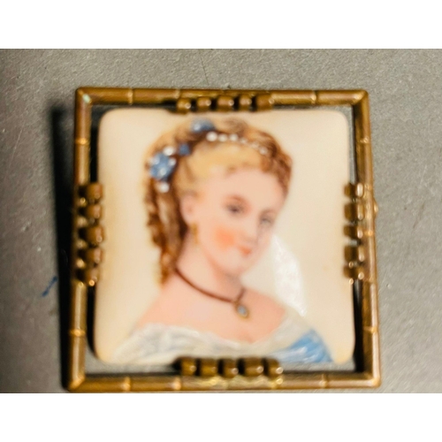 374 - Limoges France porcelain portrait brooch pair from the mid 20th century