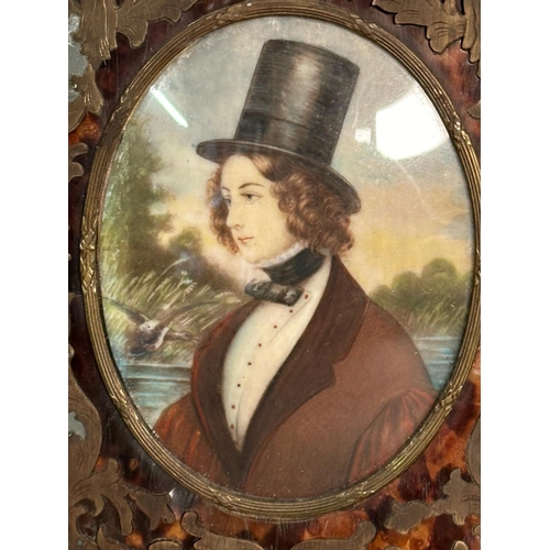 375 - A miniature portrait of a young man in a lead frame with brass and tortoiseshell inlay