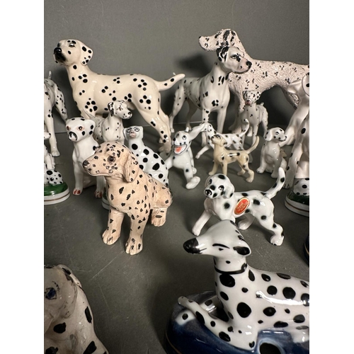 383 - An extensive collection of ornamental dalmatians various makers to include Beswick