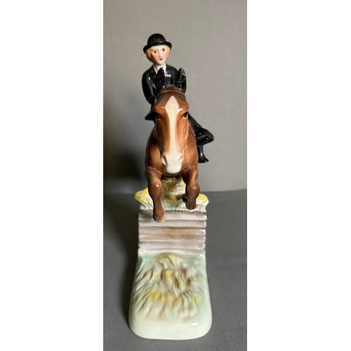 386 - A Beswick figure of a lady riding a hunter AF