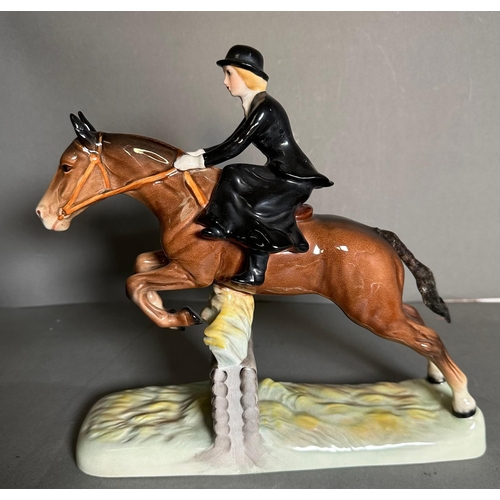 386 - A Beswick figure of a lady riding a hunter AF