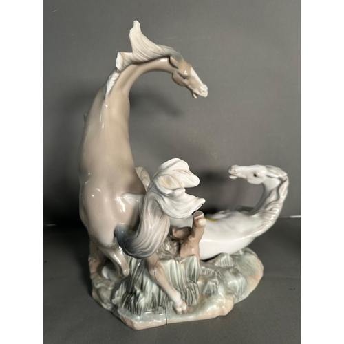 391 - A selection of AF porcelain figures to include Lladro Playful horse no 4597, Fierce pursuit deer and... 