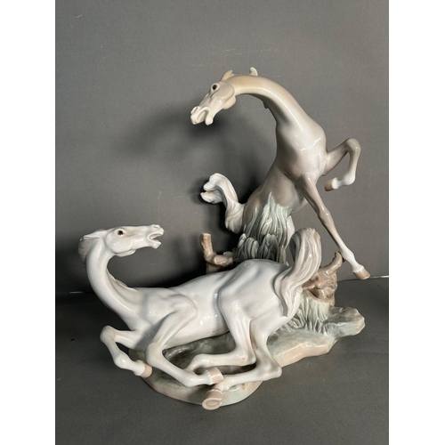 391 - A selection of AF porcelain figures to include Lladro Playful horse no 4597, Fierce pursuit deer and... 