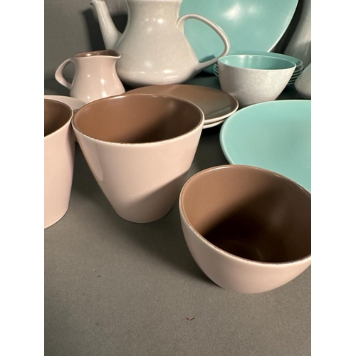 397 - A part pool pottery breakfast set in browns and green and white to include cups, saucers, egg cups a... 