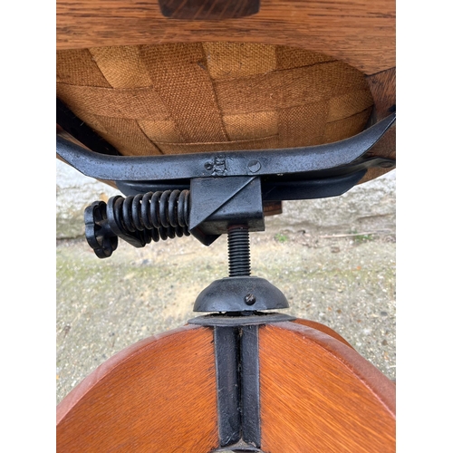 4 - An oak revolving desk chair