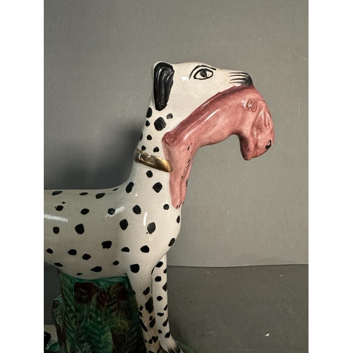 416 - A Staffordshire flatback of a Dalmatian with rabbit