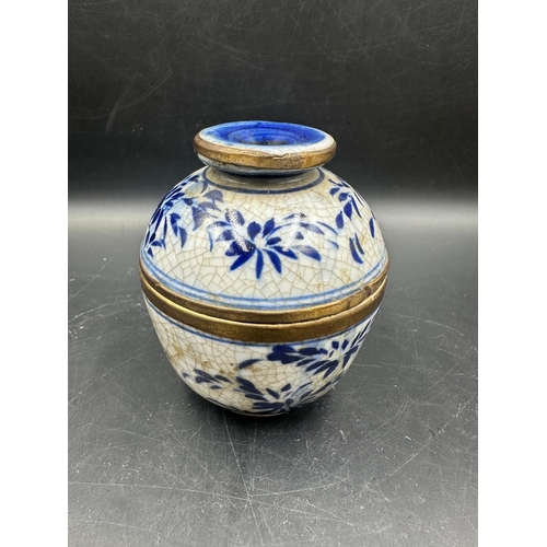 424 - Two blue and white crackle glazed Chinese lidded pots, marked to base