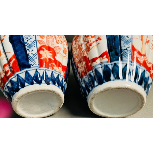 426 - Two Japanese Imari pattern ceramic table vases