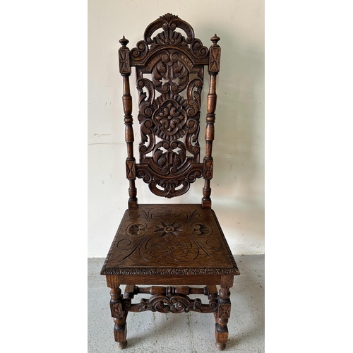 43 - A pair of Victorian style oak hall chairs with carved seats and back, turned supports ending in orna... 