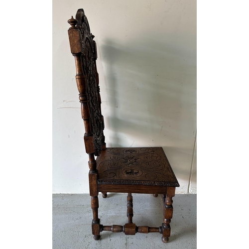 43 - A pair of Victorian style oak hall chairs with carved seats and back, turned supports ending in orna... 