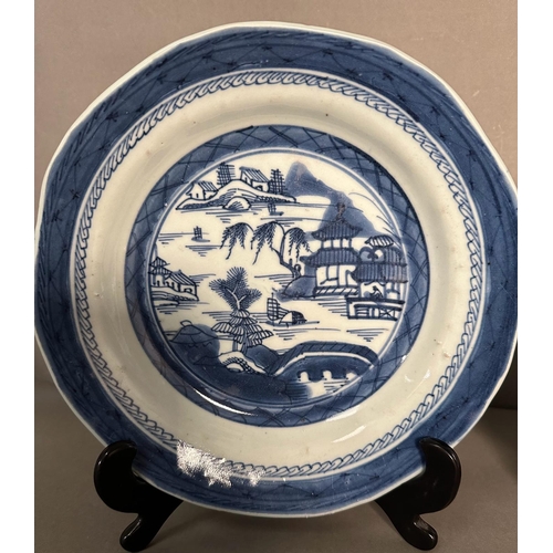 430 - Two Chinese blue and white bowls with village country scene patterns