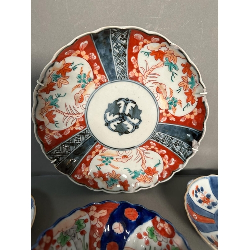 431 - A selection of bowls and dishes in the Imari palette, various ages and styles