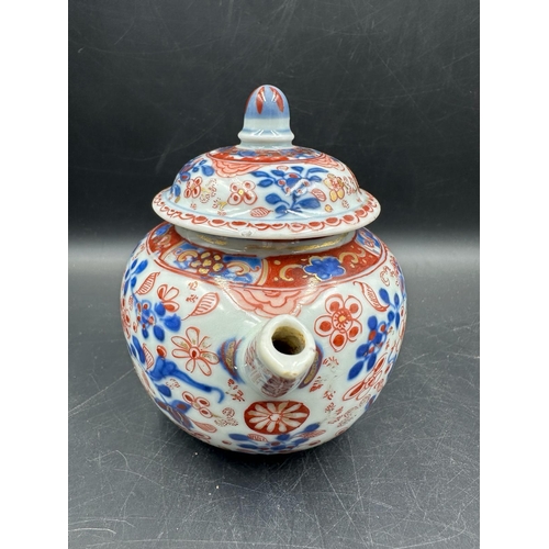 432 - A Chinese globular tea pot with Imari cartouche decoration