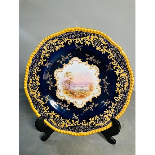 434 - A selection of five early 20th century Coalport hand painted plates with blue grounds, under an acid... 