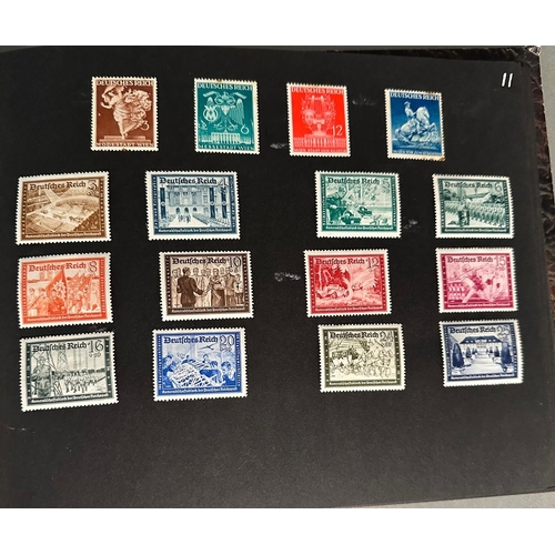 454 - A WWII era German stamp album with a range of various stamps, denominations and issues.