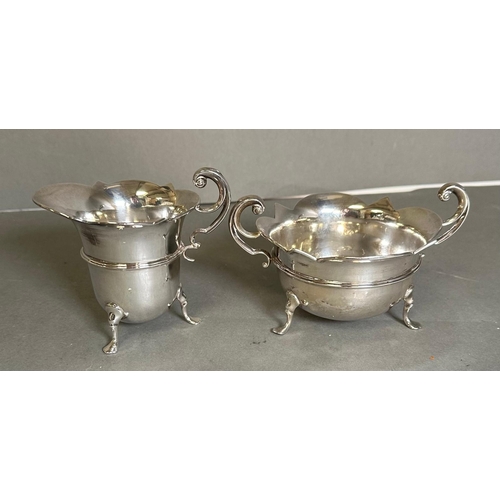 474 - A three piece silver tea service to include a teapot, milk jug, and sugar bowl by Watson & Gillott h... 