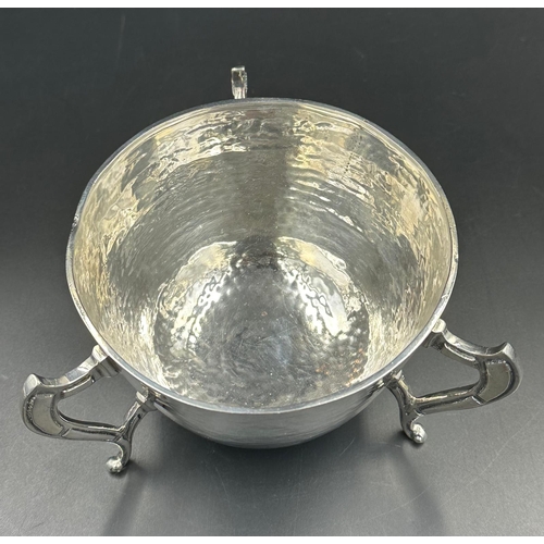 480 - A silver three legged bowl with hammered decoration by George Nathan & Ridley Hayes, hallmarked for ... 