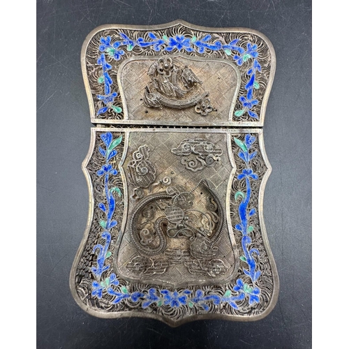 501 - A 19th Century Chinese silver wirework card holder with serpentine edge and floral border