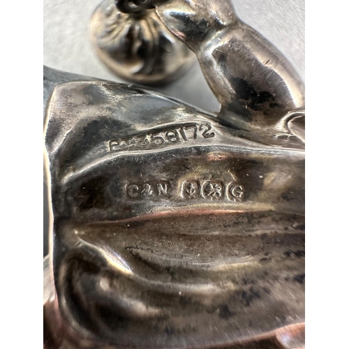 512 - An antique silver babies rattle by Crisford & Norris Ltd, hallmarked for Birmingham 1931