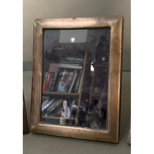 528 - Three silver photograph frames marked 925 (Largest 17cm x 22cm)